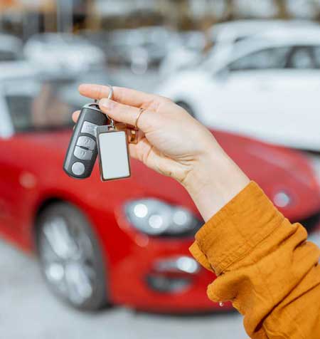 girl holding car key
